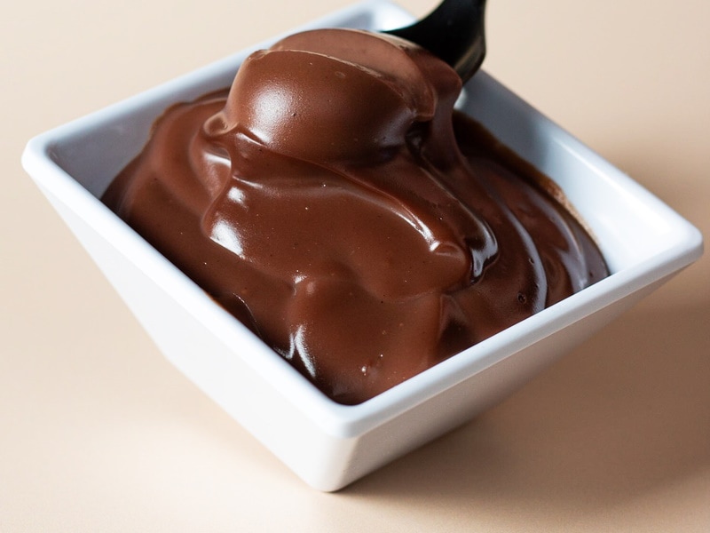 Chocolate pudding in a white ceramic bowl