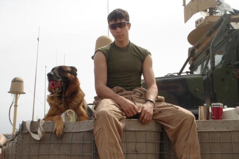 Dustin J. Lee with Lex dog in Iraq