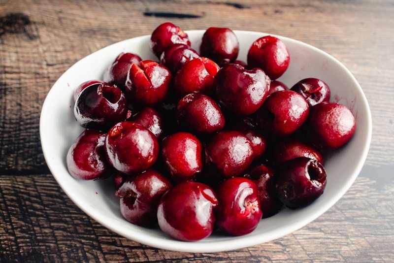 Freshly-pitted cherries in a bowl