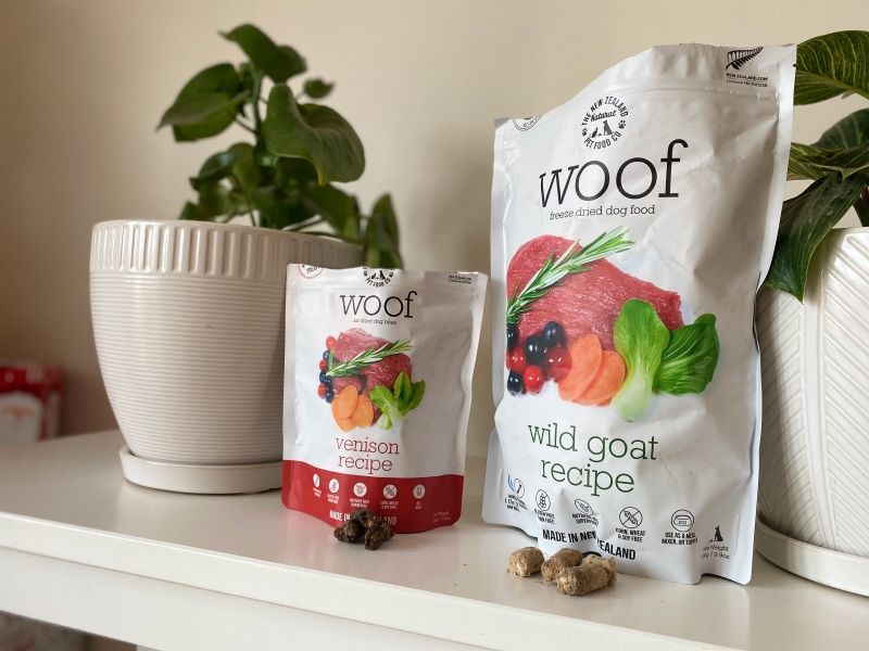 The New Zealand Natural Pet Food Co. Freeze Dried Food and Air Dried Dog Bites - close up of treats out against bag