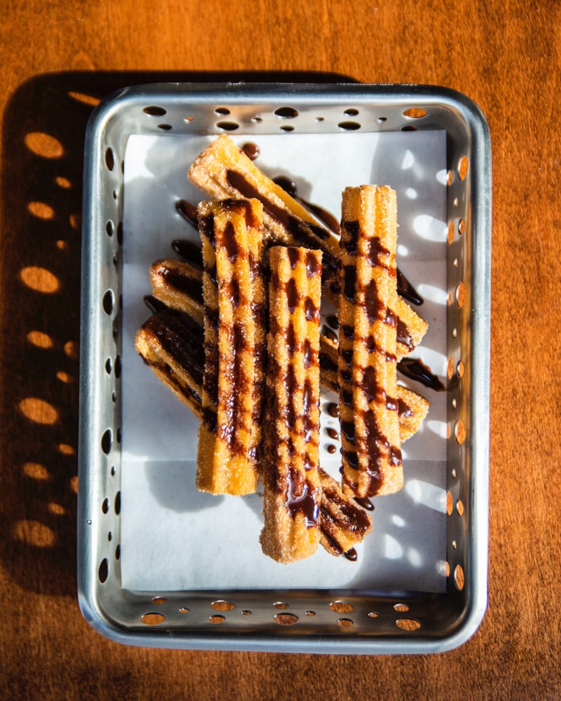 churros in a metal basket