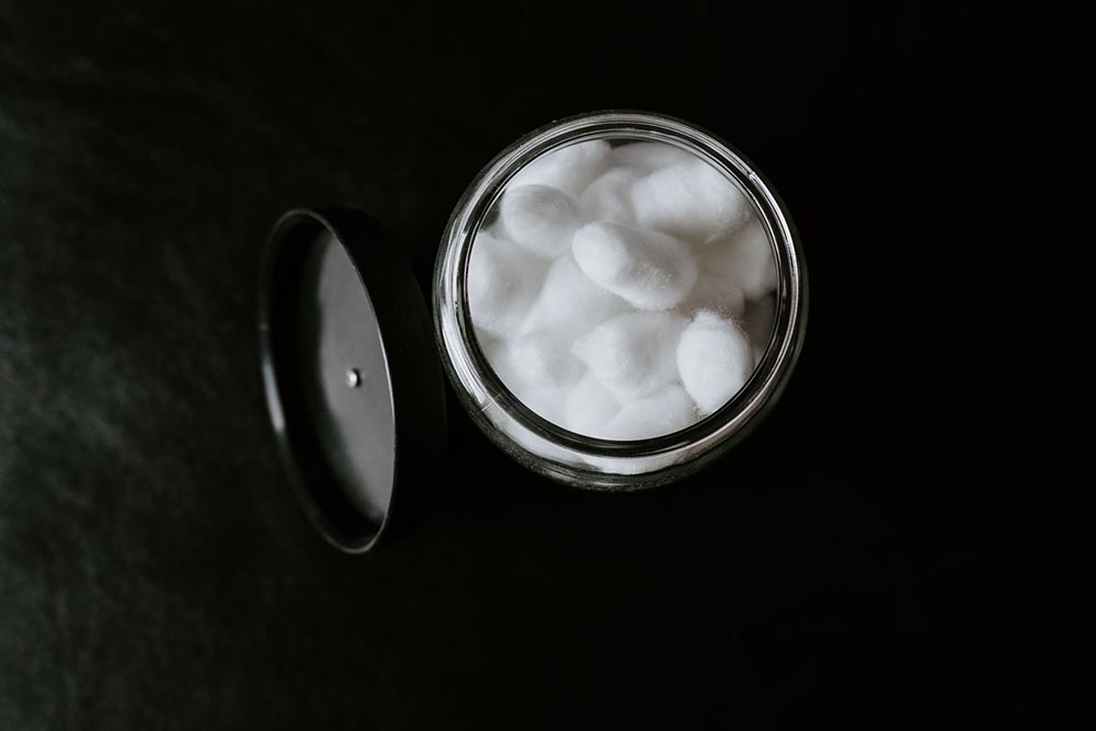 cottonballs in a glass jar