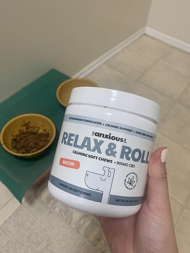 hand holding Anxious Pet Relax & Roll Calming Chews