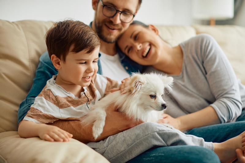 happy family with white dog