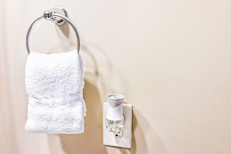 plug-in air freshener with white towel