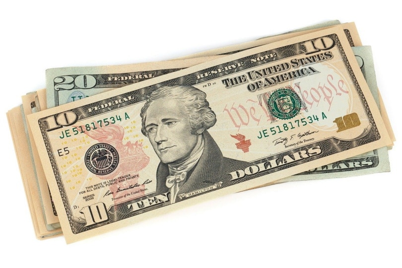 stack of cash bills on white background