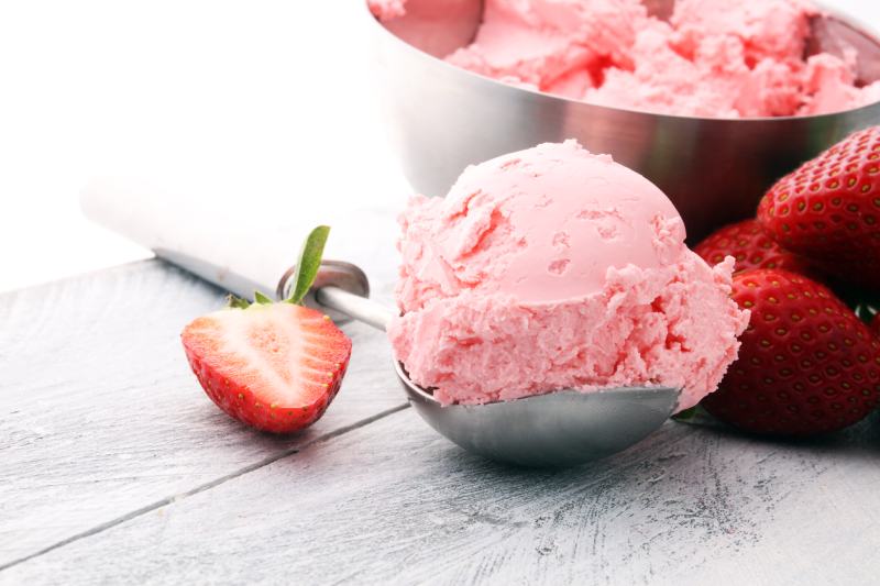 strawberry ice cream scoop with fresh strawberries