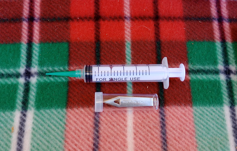 syringe and small-precision forceps