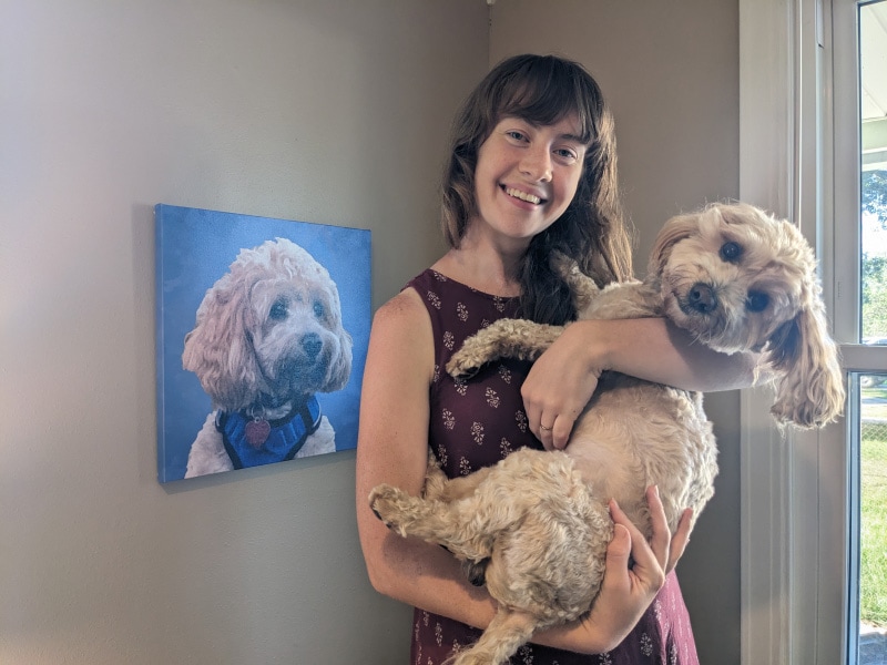 tuggles and brooke posing next to canvaspop dog portrait