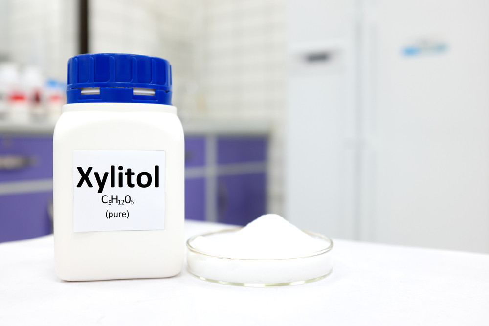 bottle of pure xylitol and sugar 